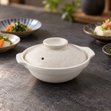 D7-K cream crackle-glazed ceramic donabe in a restaurant table setting