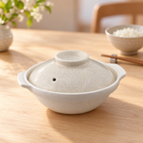 D8-K cream crackle-glazed ceramic donabe in a restaurant table setting
