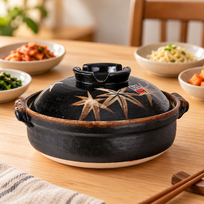 D8-ML maple-leaf donabe in a restaurant table setting