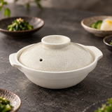 D9-K cream crackle-glazed ceramic donabe in a restaurant table setting