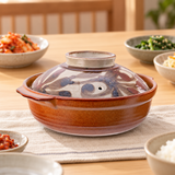 F6-K donabe with botanical lid in a dining setting