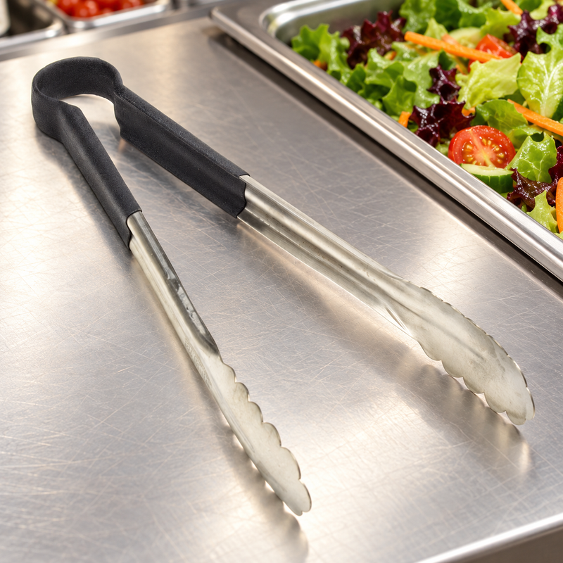 SLTG812K utility tong in a restaurant setting