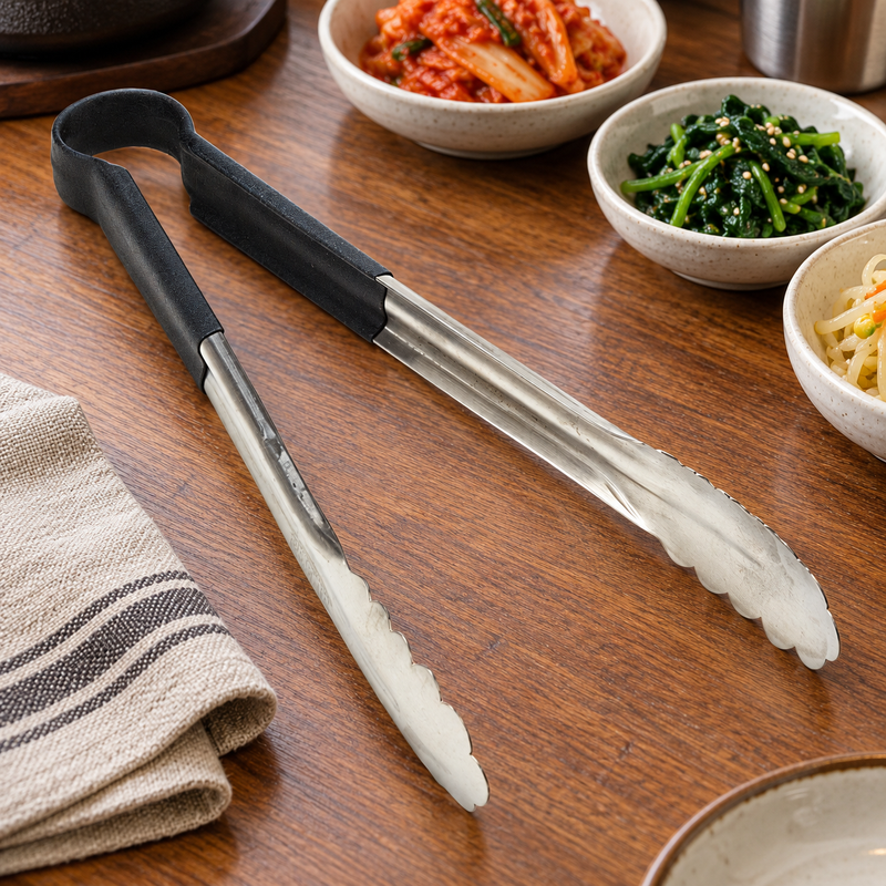 SLTG812K utility tong in a restaurant setting