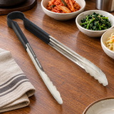 SLTG812K utility tong in a restaurant setting