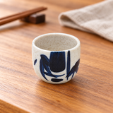 KY8-B blue bamboo sake cup on a wooden table