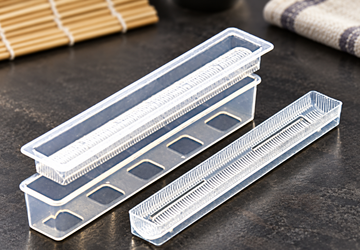 L-8582 transparent sushi mold components in their source arrangement on a prep counter