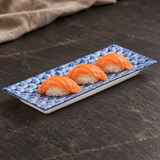LW436-B01 blue-and-white fan-pattern rectangular plate with salmon nigiri on a charcoal tabletop