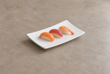 White curved rectangular melamine plate with sushi