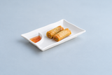 White divided melamine plate with spring rolls and dipping sauce