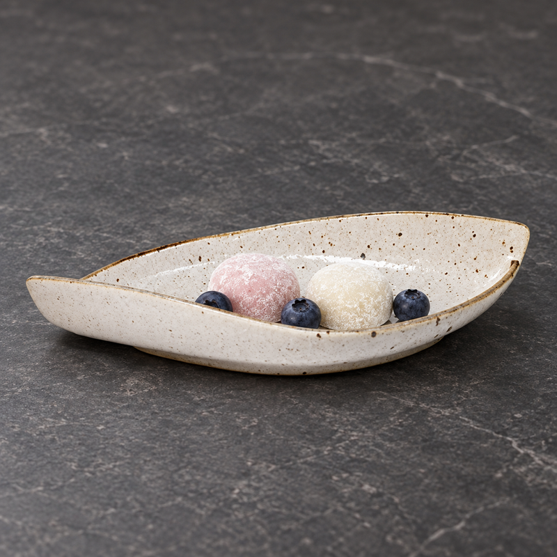 MA311-WK cream speckled ceramic leaf plate with mochi and blueberries