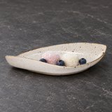 MA311-WK cream speckled ceramic leaf plate with mochi and blueberries