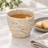 MA70-3 ceramic teacup with tea and a separate snack plate
