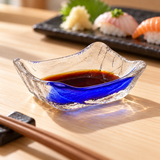 MF5 blue-streak glass sauce dish with soy sauce beside sushi