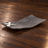 MK212W-WB curved dark platter with white brush accent, on a wooden table