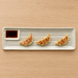 MPD213-W divided ceramic platter with gyoza and soy sauce