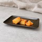 Dark rectangular ceramic platter in a dessert serving scene