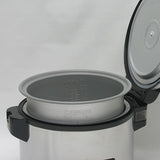 Zojirushi NYC-36 with lid open and nonstick inner cooking pan lifted to show its rice and water markings.