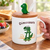 White dinosaur mug with lid and spoon held at a breakfast table