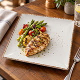 Splash Blanch 10-inch square plate with grilled chicken and vegetables