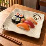 811S-E Eggplant-pattern melamine plate — Shared sushi selection of four maki pieces and three nigiri loosely arranged in the center on warm wood with chopsticks outside plate