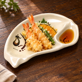 E09-E Eggplant half-moon melamine plate with tempura and dipping sauce on a wooden table