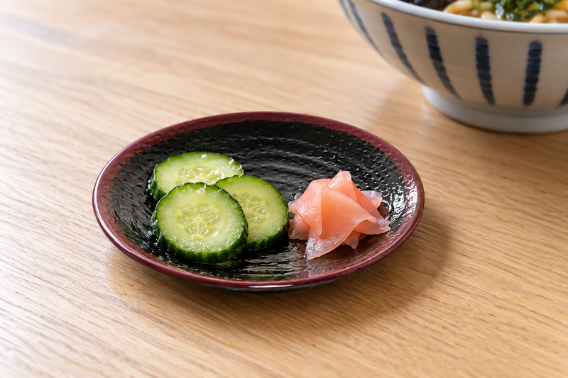 1704TM 4-inch Tenmoku side plate with cucumber pickles and ginger
