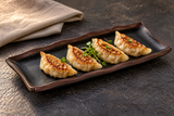 IT-F54011TM black and brown waved-rim melamine plate serving gyoza appetizers