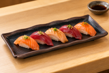 IT-F54011TM black and brown waved-rim melamine plate serving nigiri sushi