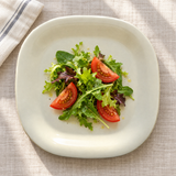 PS3008V Passion Pearl melamine plate with a small leafy salad and tomato wedges, serving suggestion
