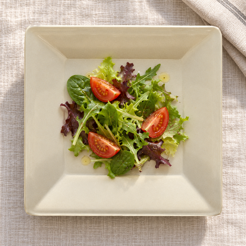 PS3208V Passion Pearl melamine plate with a small leafy salad and tomato wedges, serving suggestion