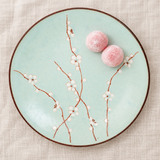 Q211-BP aqua blossom plate with pink mochi in a table setting