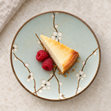 Round floral plate with dessert in a table setting