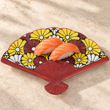 Floral fan-shaped ceramic plate with salmon nigiri