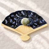 Dragonfly fan-shaped ceramic plate with green tea mochi and blueberries