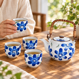 Blue floral tea set with four cups during shared service