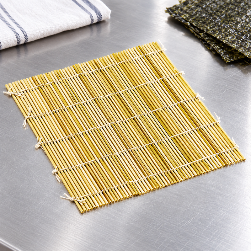 009129 bamboo rolling mat on a stainless preparation counter