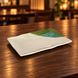 511-M wavy beige green-corner plate empty on a wooden restaurant table