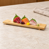 DJ-WDGT45 wooden sushi board on a restaurant tabletop