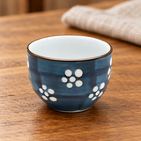 GY18-S1 sake cup in a wooden tabletop setting; representative pattern shown, sold as one assorted-design cup