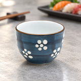 GY18-S1 sake cup in a sushi dining setting; representative pattern shown, sold as one assorted-design cup