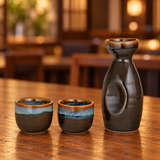 JX12-3 sake set with one bottle and two cups on a wooden restaurant table