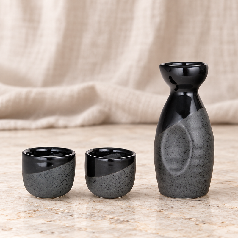 JX12-6 three-piece black-and-grey sake set on a table