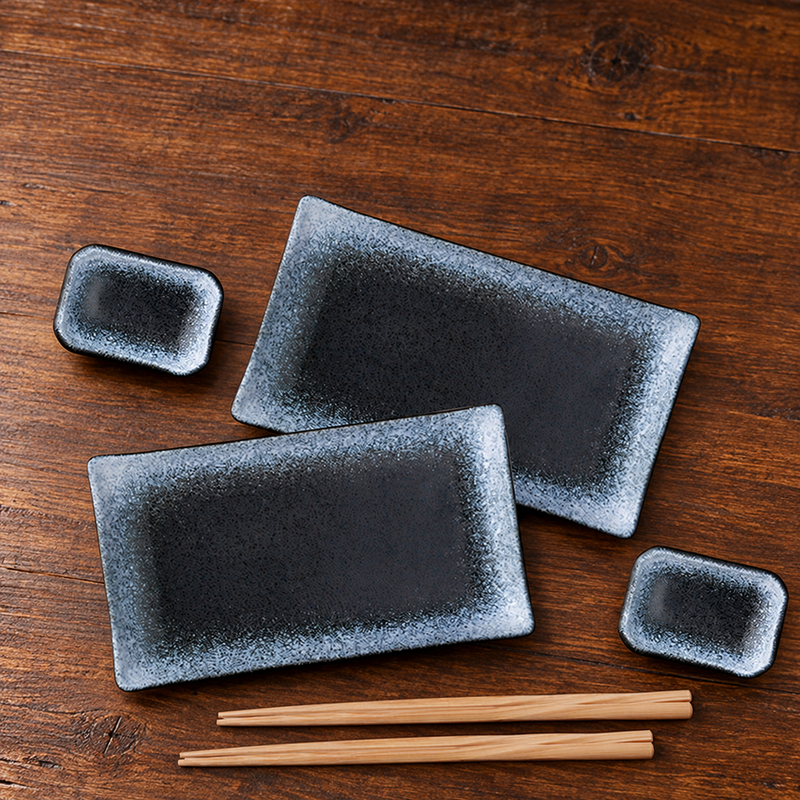 JX79-2 blue sushi setting with two plates, two sauce dishes and two chopstick pairs on a counter