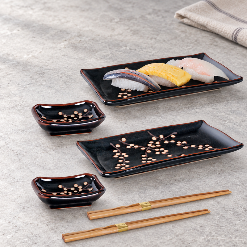 Two dark floral JX79-TP ceramic place settings on a dining table