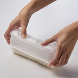 KK-282 sushi mold shown inverted while pressing out a formed rice roll
