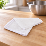 NET2-T fine-mesh rice steamer net on a wooden kitchen preparation surface
