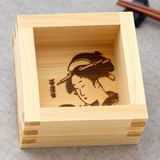 OMS-102 wooden masu showing its Utamaro portrait on the interior base in a dining setting