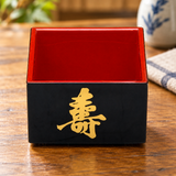 OMS-5 black and red sake masu with gold longevity motif on a wooden table