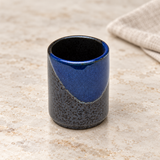 PL8-N tall black and blue sake cup, on a pale stone counter