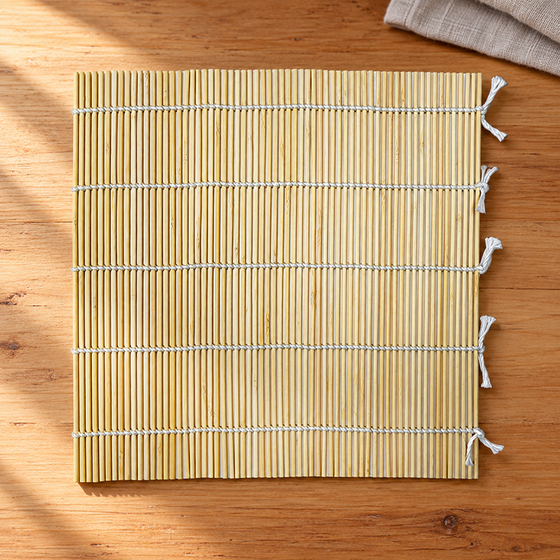 SM2495 bamboo sushi mat on a wooden preparation counter